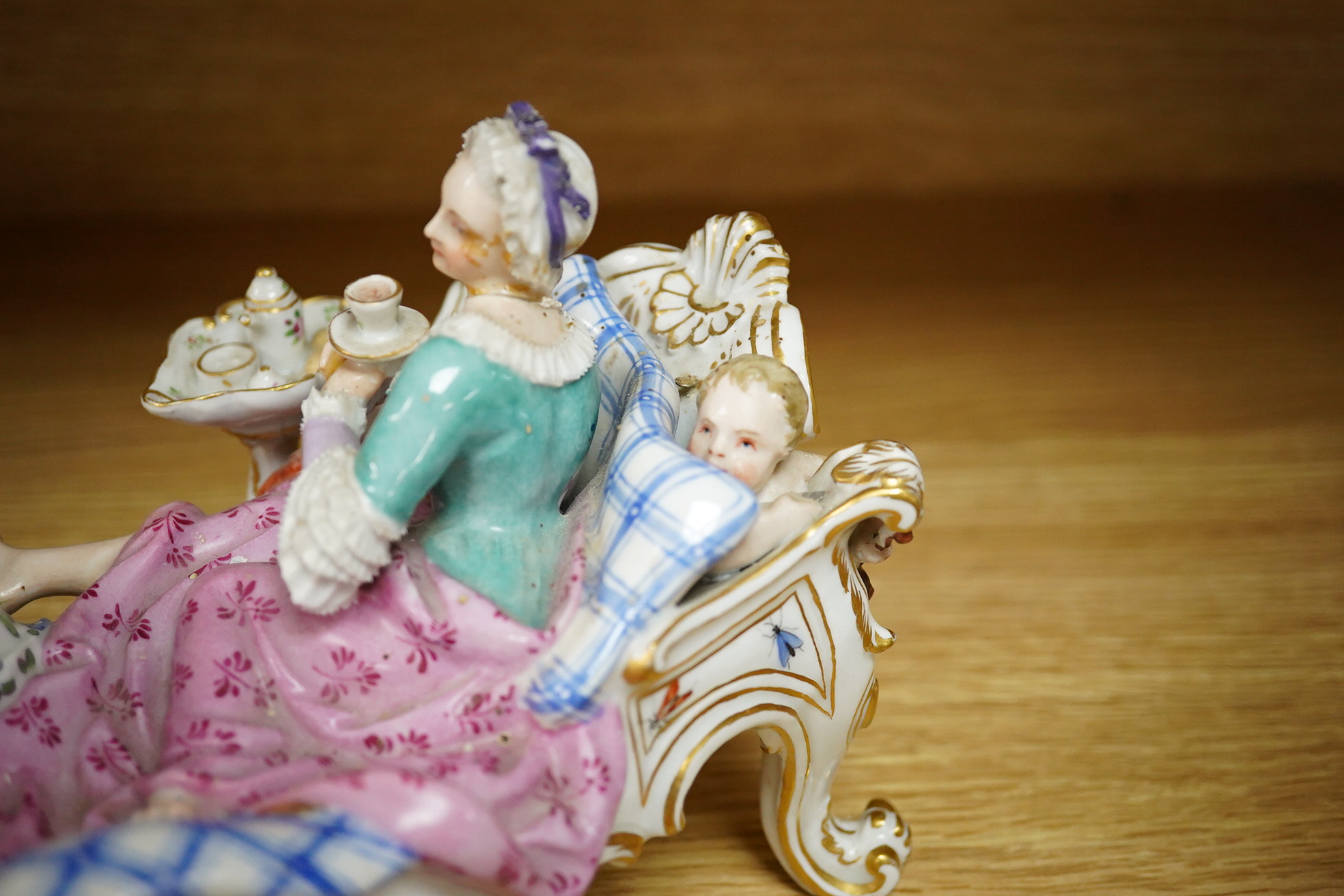 A Meissen style porcelain figure group ‘Discovered Lover’, 19cm wide